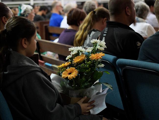 A crowd gathers at the Darwin Memorial Uniting Church to mourn death of four men who were allegedly shot dead by Ben Hoffmann. Picture: Keri Megelus