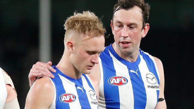 Jaidyn Stephenson (left) is consoled by veteran ruckman Todd Goldstein., Picture: Michael Willson/AFL Photos via Getty Images