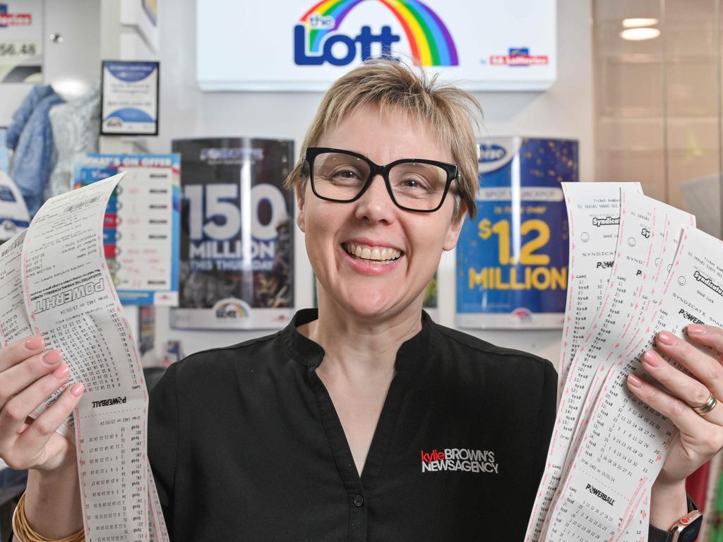 Kylie Brown in her Glenelg newsagency with Powerball syndicate entries as this week’s jackpot surges to $150 million. Picture: NewsWire / Brenton Edwards