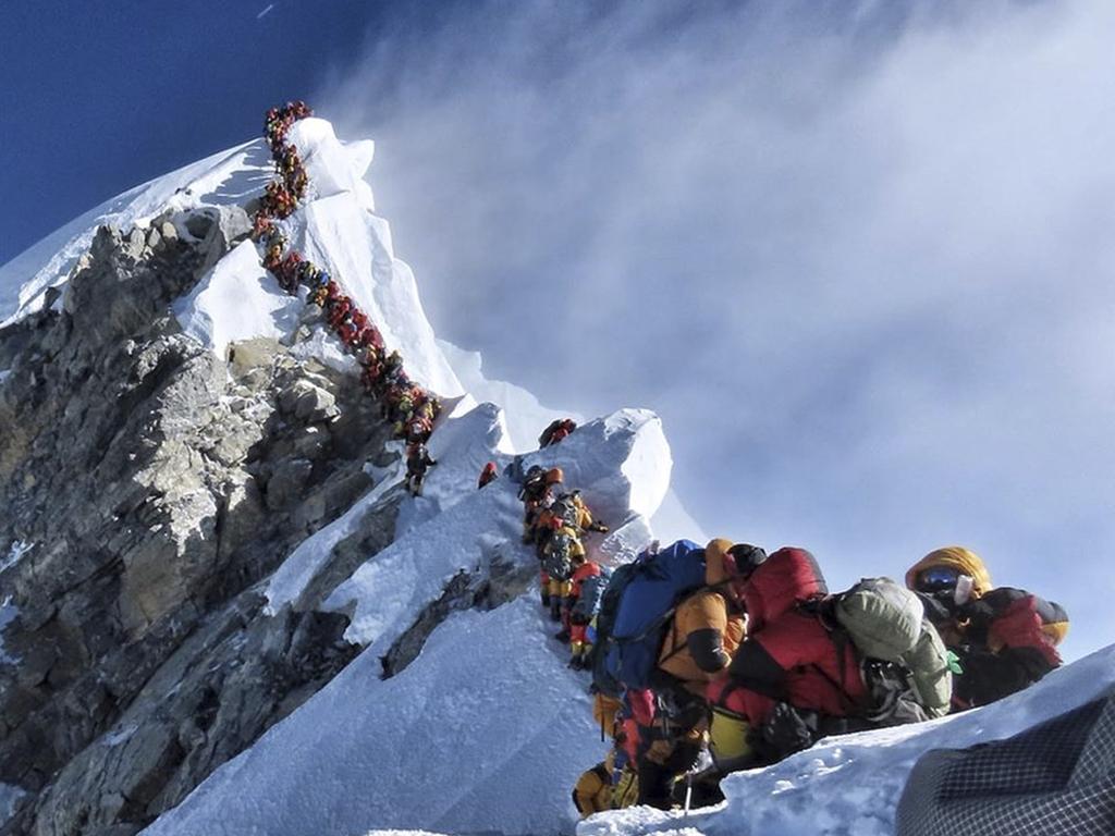 A long queue of mountain climbers line a path on Mt Everest during a horror season for the world’s highest peak. Picture: Nimsdai Project Possible via AP