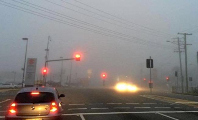 LIGHTS ON: Fog blankets the Bruce Highway in Gympie early Monday morning. Picture: Frances Klein