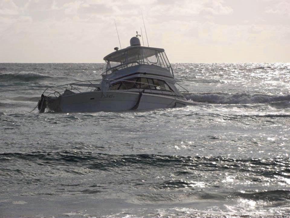 A luxury Riviera cruiser has been run aground on Fraser Island after taking water overnight. Picture: Contributed