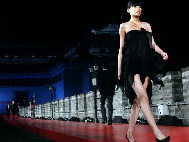 Models wearing Pierre Cardin's collection during a show staged on the ancient city walls of Beijing. Picture: AFP