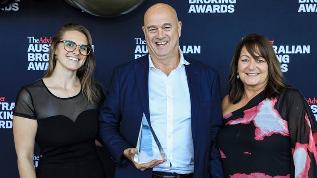 Georgia Bice with her parents who have put up the equity in their Hobart investment property to allow their daughter to purchase her first home. Picture: Supplied