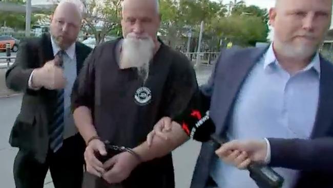 Allan Michael Dyson (middle) being extradited from Queensland to NSW in 2022. Picture: ABC News