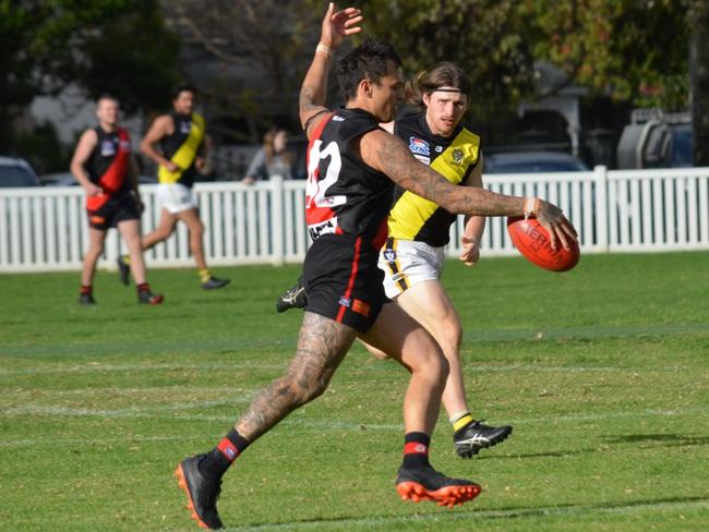 Coach Ryan Handley takes a kick for the Jets. Pic: Black Rock FNC