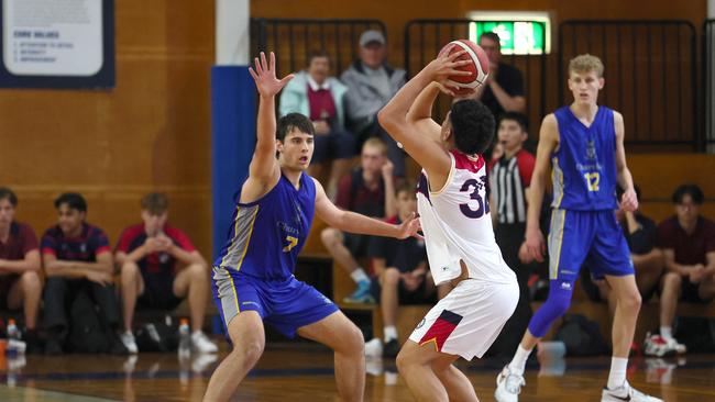 Action from the GPS basketball round 1 match between Brisbane State High and Churchie. Picture: Tertius Pickard