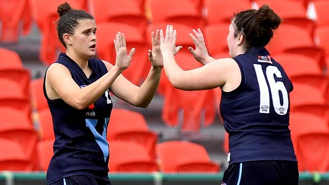 GOLD COAST, AUSTRALIA - JULY 08: Nell Morris-Dalton (L) of Vic Metro celebrates kicking a goal during the 2019 NAB AFLW Under 18 Championships match between Vic Metro and Western Australia at Metricon Stadium on July 08, 2019 in Gold Coast, Australia. (Photo by Bradley Kanaris/AFL Photos/via Getty Images)