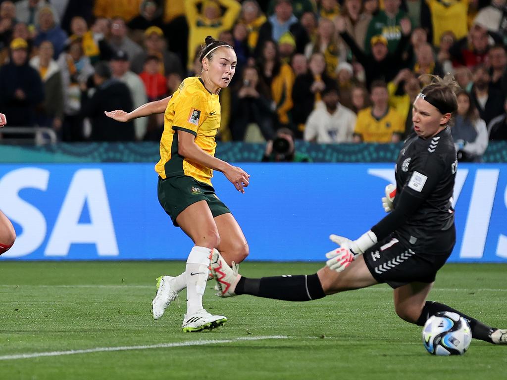 Caitlin Foord beats Lene Christensen to score Australia’s first goal. Picture: Brendon Thorne/Getty Images