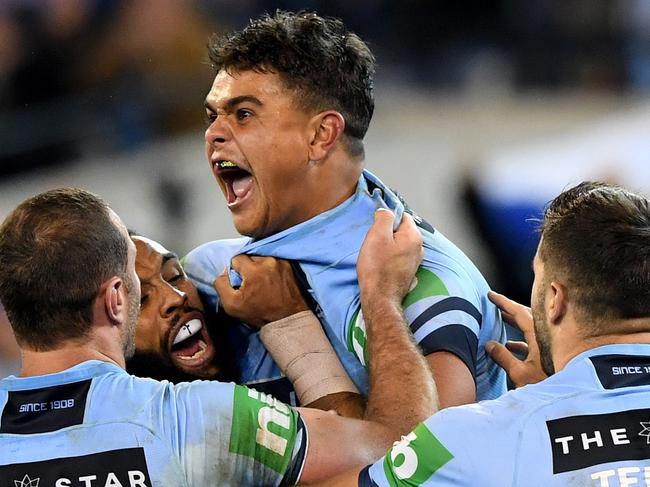 Latrell Mitchell of the Blues celebrates after he scores a try during Game 1 of the 2018 State of Origin series at the MCG in Melbourne, Wednesday, June 6, 2018. (AAP Image/Joe Castro) NO ARCHIVING, EDITORIAL USE ONLY