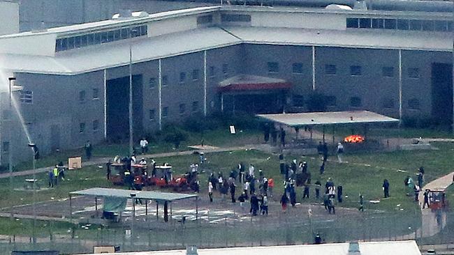 Rioting prisoners gather in the yard at MRC in Ravenhall. Picture: Mark Stewart