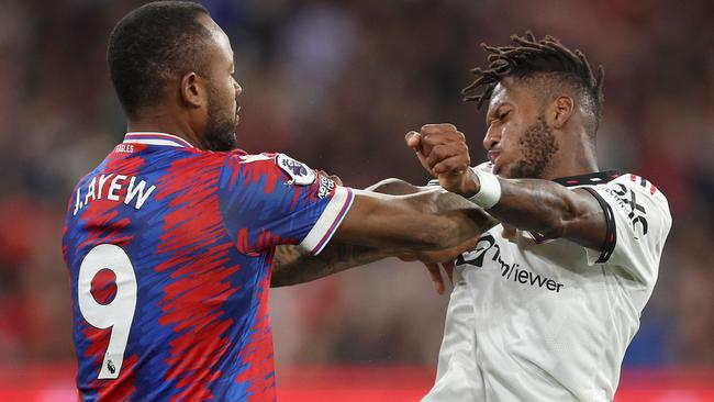 Crystal Palace’s Jordan Ayew and United’s Fred get physical. Picture: AFP