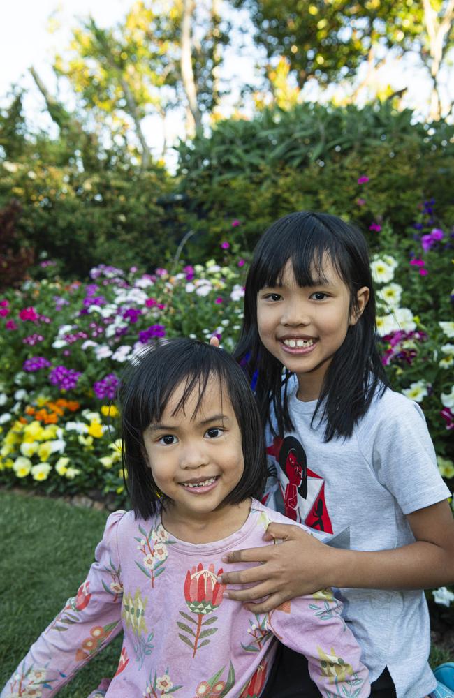 Sisters Gia (left) and Sophie Dang in The Chronicle Garden Competition City Reserve Grand Champion garden of Cheryl Ganzer during the Carnival of Flowers, Saturday, September 21, 2024. Picture: Kevin Farmer