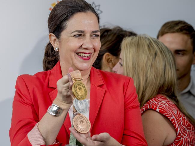 Queensland Premier Annastacia Palaszczuk at the The Star Gold Coast Casino on the Gold Coast holding up the gold, silver and bronze 2018 Gold Coast Commonwealth Games medals.   Picture: Jerad Williams