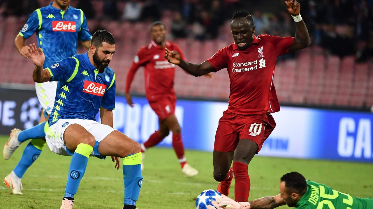 Napoli's Colombian goalkeeper David Ospina (Bottom R) makes a save under pressure from Liverpool's Senegalese forward Sadio Mane (R)