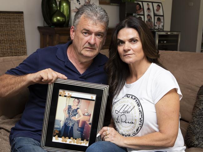 Mark and Teresa Marsden holding a picture of their beloved daughter Renae, who took her own life after being victim of a catfishing relationship in 2013.