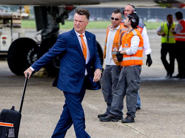 Netherland's football team head coach Louis van Gaal arrives at Rotterdam-The Hague airport in Rotterdam, on July 13, 2014. Brazil's miserable World Cup campaign ended in a chorus of boos on July 12, 2014 as the hosts slumped to a 3-0 defeat against the Netherlands in the third place playoff match. AFP PHOTO / ANP / SANDER KONING ***Netherlands Out***