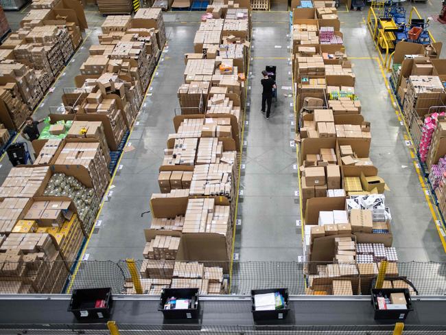 Australian Amazon staff are likely to be working under better conditions than those in other countries, and that might mean Amazon will have to charge more for their delivery. Picture: Chris J Ratcliffe / AFP