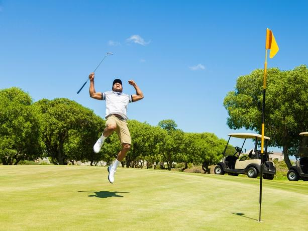 RendezView. Excited golfer, arm raised up after sinking his putt in the hole. (Pic: iStock)