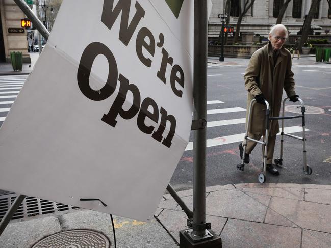 A man walking along an empty street in Manhattan as the coronavirus continues to keep much of the American economy shut. Picture: Spencer Platt/Getty