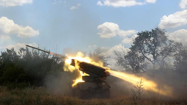 Ukrainian servicemen open fire on Russian positions with a Grad BM-21 multiple rocket launcher at the front line between Russian and Ukraine forces in the countryside of the eastern Ukrainian region of Donbas this month. Picture: AFP