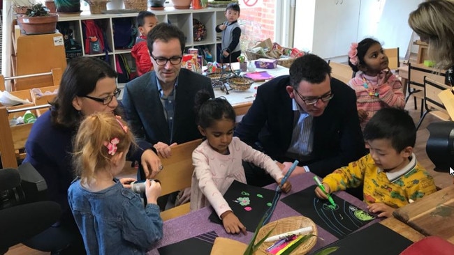 Daniel Andrews joins children at the McKinnon centre for the announcement.