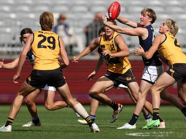 Tom Gross fires out a handpass for Vic Metro. Picture: Paul Kane/AFL Photos