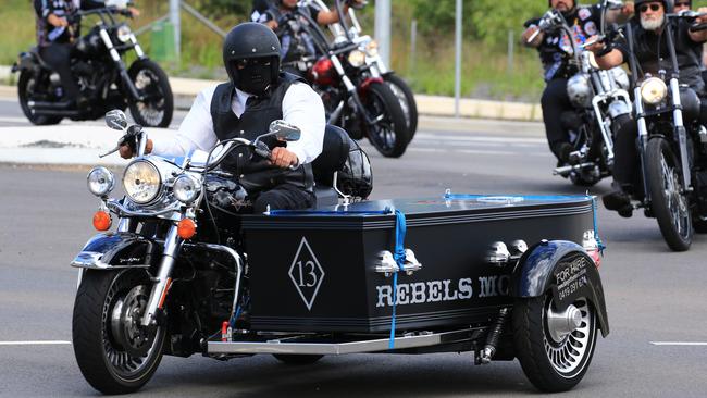 Funeral of Rebels bikie Darren Wallace’s coffin arrives at his funeral on a motorcycle. Picture: Adam Taylor