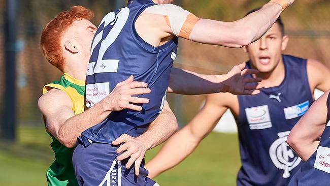 Bayswater’s Ben White takes on a Croydon opponent last weekend. Picture: Hotker’s Footy Photos