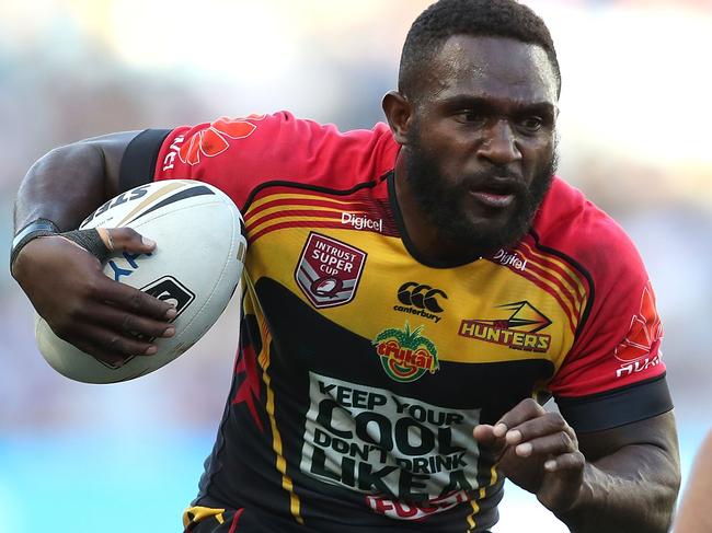 SYDNEY, AUSTRALIA - OCTOBER 01:  Ase Boas of the Hunters is tackled during the 2017 State Championship Final between the Penrith Panthers and Papua New Guinea Hunters at ANZ Stadium on October 1, 2017 in Sydney, Australia.  (Photo by Mark Metcalfe/Getty Images)