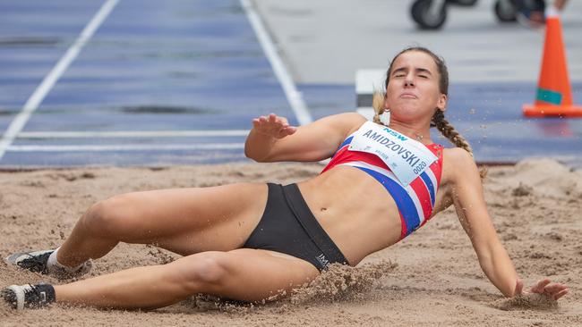 Delta Amidzovski from Albion Park lands in the U17 long jump at the NSW Junior Athletics championships at Sydney Olympic Park.