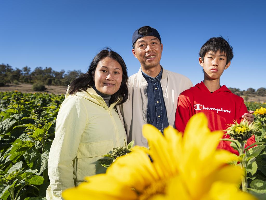 Brisbane visitors (from left) Iris Hu, Ronald Huang and Robbie Huang at Warraba Sunflowers, Saturday, June 22, 2024. Picture: Kevin Farmer