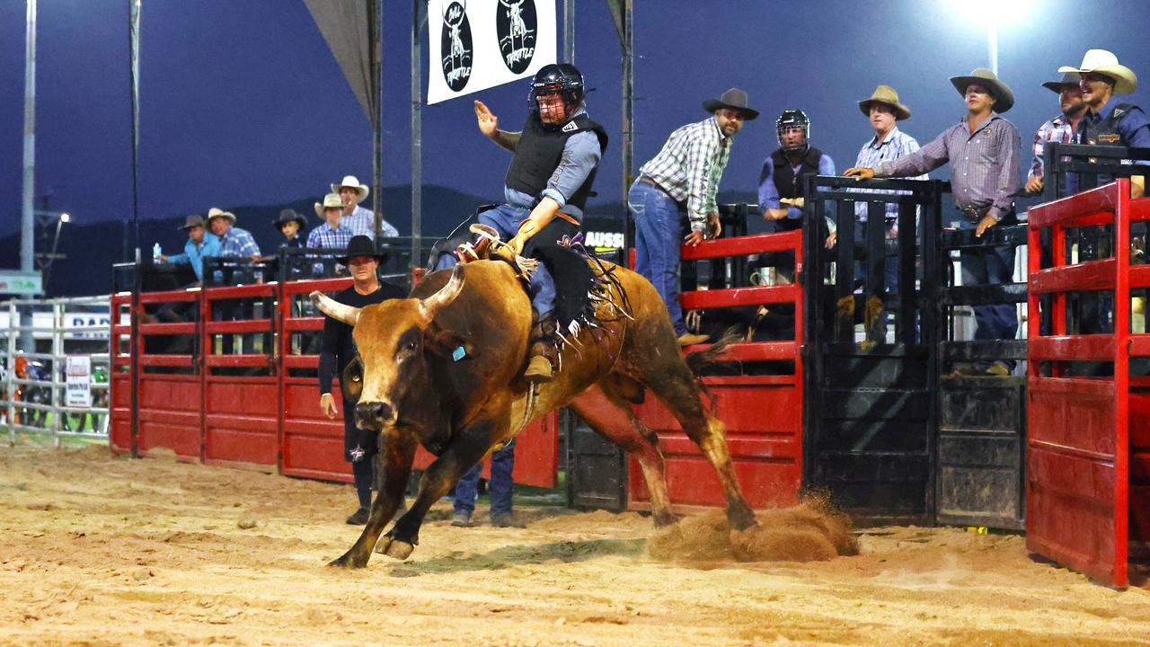 Harley Armstrong rides in the novice bull ride at the 2024 Cairns Bull Throttle event, a bikes and bulls show, featuring bull riding and freestyle motocross riders at the Cairns Showgrounds. Picture: Brendan Radke