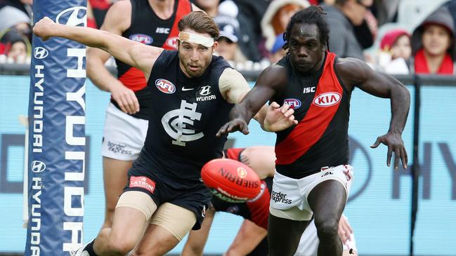 Carlton’s Dale Thomas and Essendon’s Anthony McDonald-Tipungwuti. Picture: Michael Klein