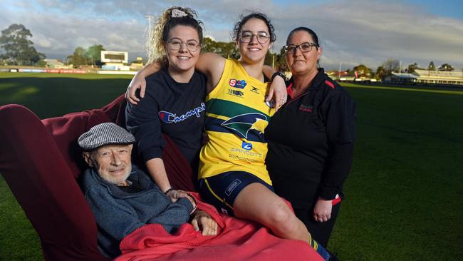 Woodville-West Torrens women's player Teagan Usher with her father John, older sister Kaylah and mother Espe. John is the family’s inspiration after surviving seven heart attacks in the past 13 years plus a deadly leg infection. Picture: Tom Huntley