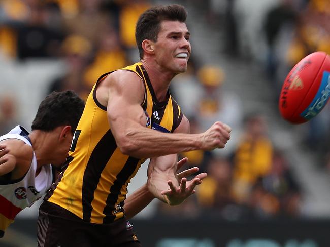 AFL Round 2. Hawthorn vs. Adelaide Crows at the MCG.  Hawthorn's Jaeger O'Meara clears by hand    . Pic: Michael Klein