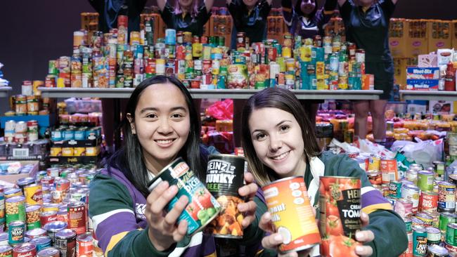 Centenary Heights State High School student council president Ria Biscocho and vice president Lily Pederick. Food donation to Lifeline Darling Downs.