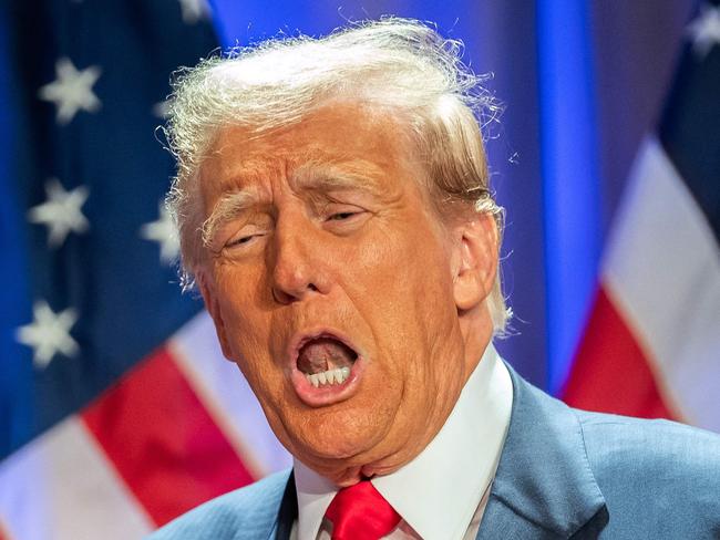 US President-elect Donald Trump gestures as he attends a meeting with House Republicans at the Hyatt Regency hotel in Washington, DC on November 13, 2024. (Photo by Allison ROBBERT / AFP)