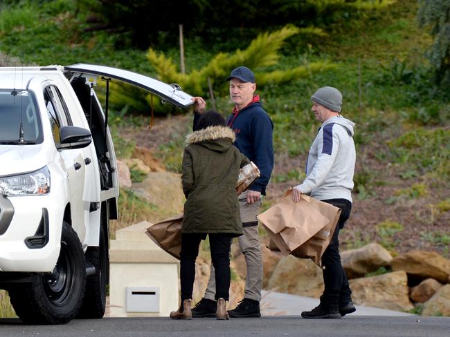 Police remove evidence from the Darley property where a woman died overnight. Picture: Andrew Henshaw