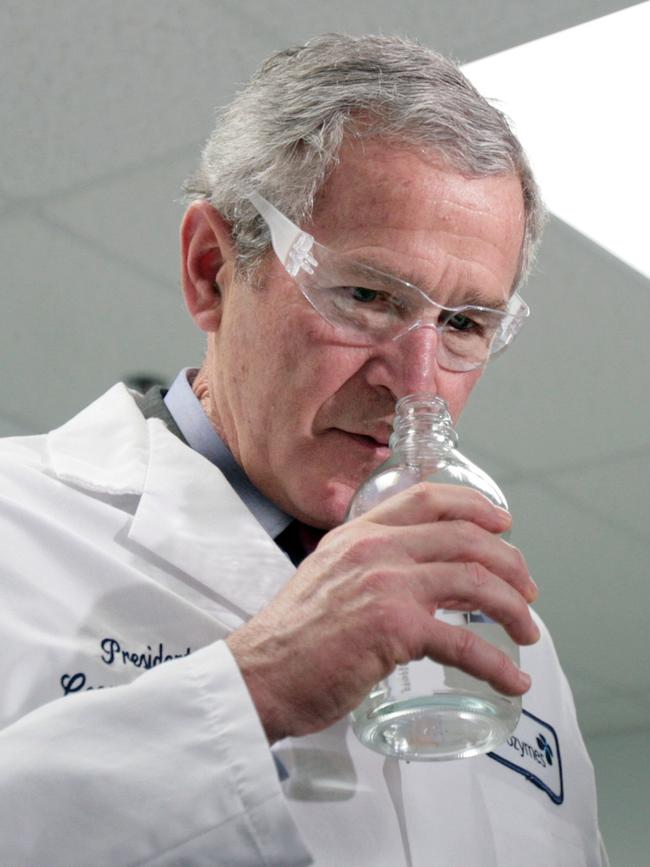 Ethanol is made from biomass. Pictured here in 2007, US President George W Bush smells a bottle of ethanol at a factory in North Carolina.