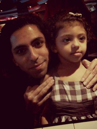 Raif Badawi, pictured with one of his children, must endure brutal lashings every week for months while serving his 10-year prison term.