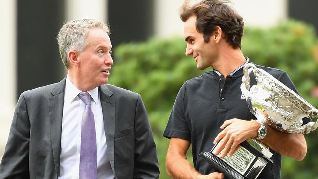 MELBOURNE, AUSTRALIA - JANUARY 30:  Roger Federer of Switzerland walks with Craig Tiley as he prepares to pose  with the Norman Brookes Challenge Cup after winning the 2017 Australian Open Men's Singles Final, on January 30, 2017 in Melbourne, Australia.  (Photo by Quinn Rooney/Getty Images)