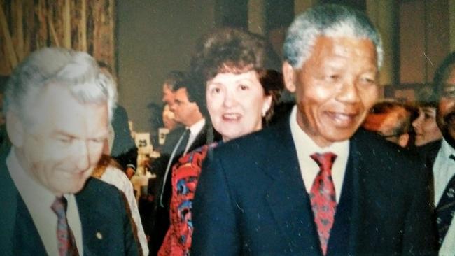 Elaine Darling with former Australian Prime Minister Bob Hawke (left) and Nelson Mandela.