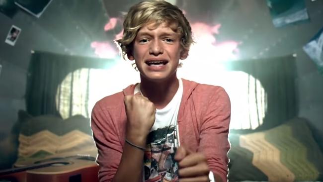 Cody Simpson (pictured in Flo Rida’s iYiYi official YouTube video) was becoming recognised for his YouTube videos around 2009, but at the time he also scored gold medals at the Queensland Swimming Championships that same year. Picture: Supplied / YouTube