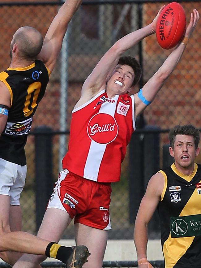 Matthew Long stretches to take a mark for South Bendigo earlier this season. The finals are in sight for the Bloods. Picture Yuri Kouzmin