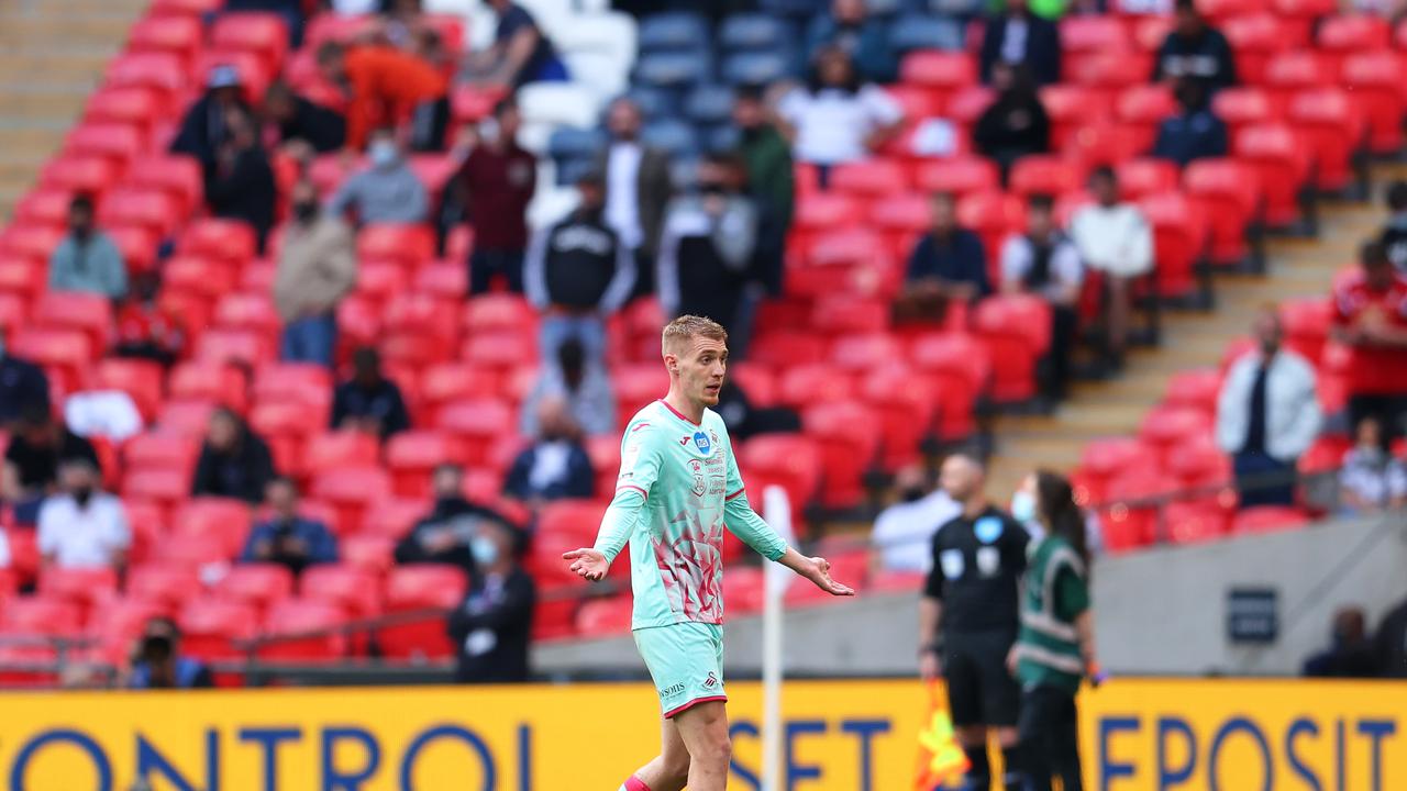 Jay Fulton of Swansea City reacts to being sent off.