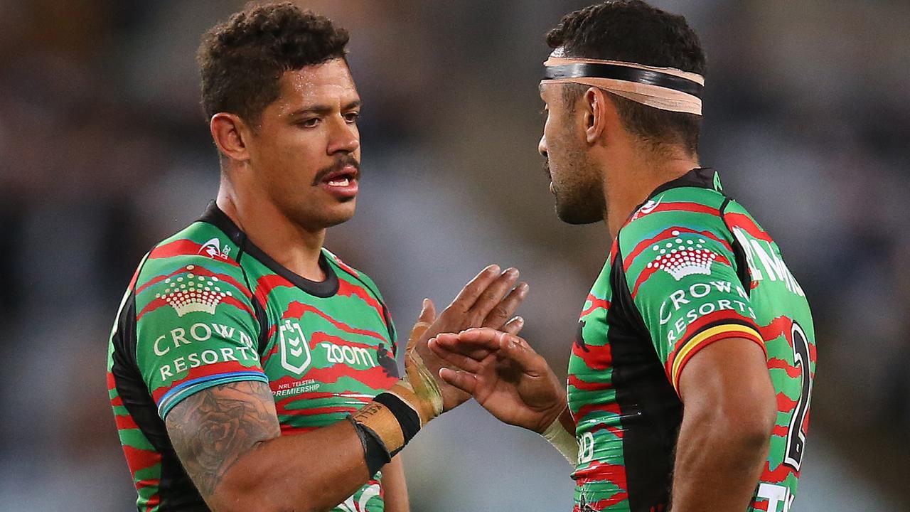 Dane Gagai (left) is being chased by the Broncos.