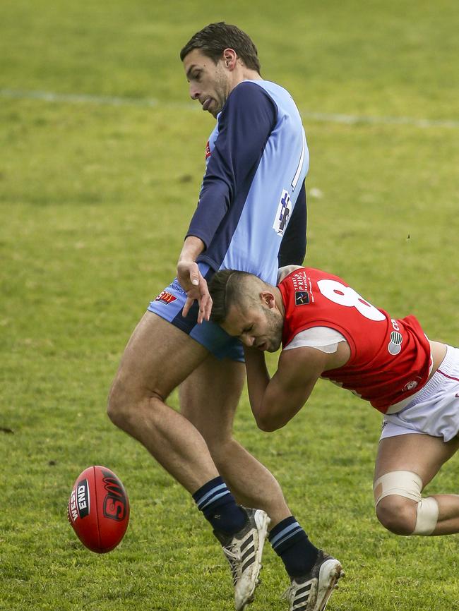 North recruit Robbie Young chases down Sturt’s Fraser Evans. Picture: AAP/Mike Burton