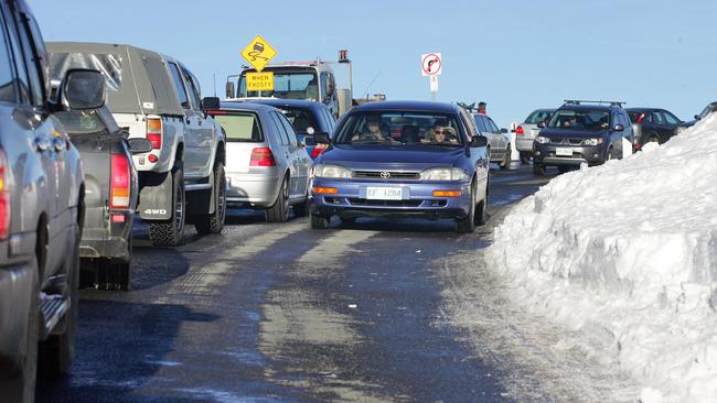 Bumper to-bumper traffic on Pinnacle Rd as hundreds of cars try to make the journey to the summit of Mt Wellington.