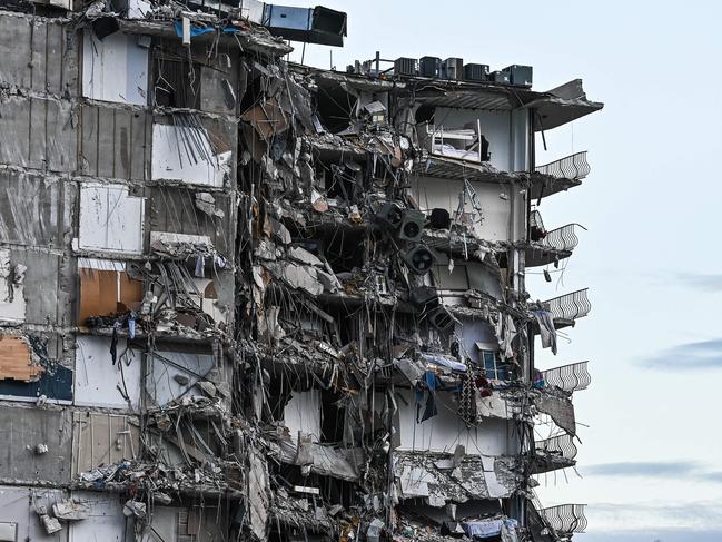 Rubble hangs from a partially collapsed building in Surfside north of Miami Beach.